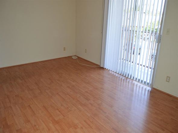 Los Angeles apartment for rent - a living room with a wood floor and a window