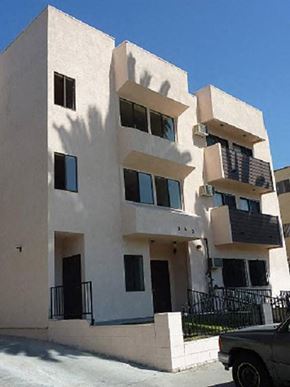 Los Angeles apartment for rent - an apartment building with a truck parked in front of it