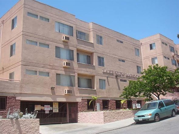 Los Angeles apartment for rent - a large building with a car parked in front of it