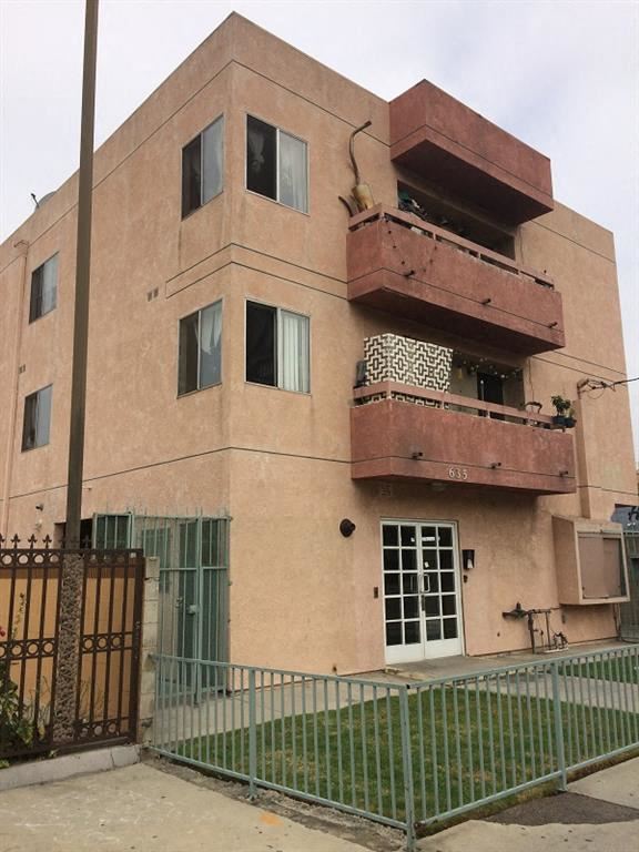 Los Angeles apartment for rent - a building with two balconies and a fence in front of it