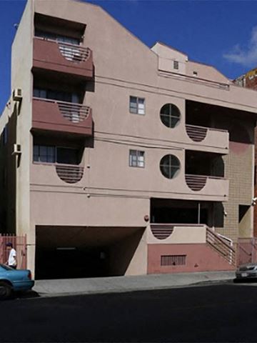 Los Angeles apartment for rent - a building with a blue car parked in front of it