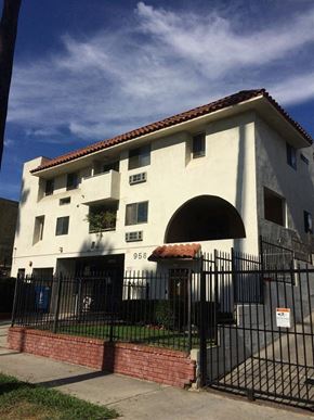 Los Angeles apartment for rent - a white building with a wrought iron fence in front of it