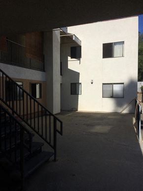 Los Angeles apartment for rent - an apartment building with stairs and a courtyard