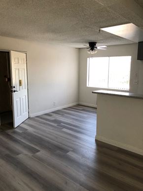 Los Angeles apartment for rent - an empty living room with wood floors and a kitchen