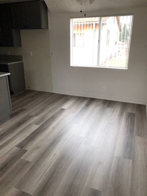 Los Angeles apartment for rent - a living room with a hard wood floor and a window