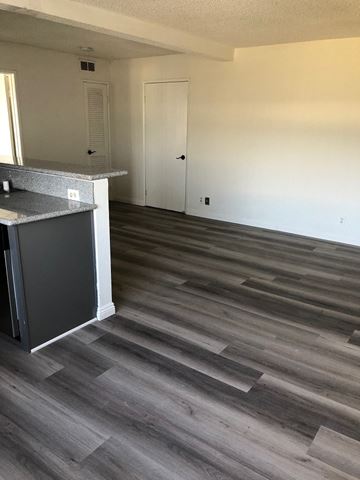 Los Angeles apartment for rent - a kitchen and living room with wood flooring in a house
