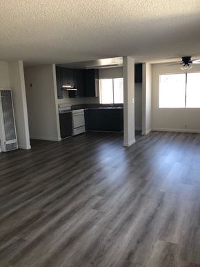 Los Angeles apartment for rent - an empty living room and kitchen with wooden floors