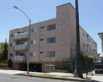 Los Angeles apartment for rent - A tall building with a balcony on the second floor.