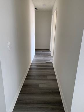 Los Angeles apartment for rent - a view down a hallway with wood floors and white walls