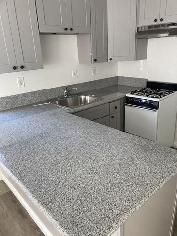 San Pedro apartment for rent - a kitchen with a counter top and a sink