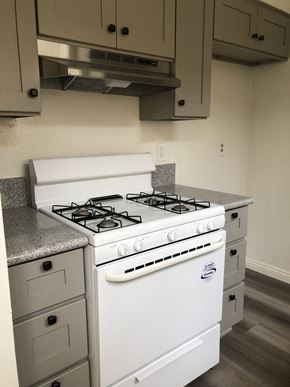 Los Angeles apartment for rent - an empty kitchen with a stove and a microwave