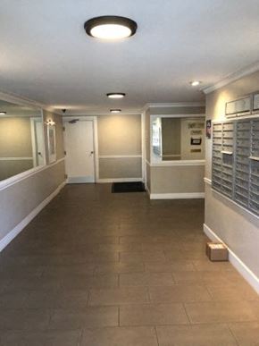 Culver City apartment for rent - a hallway with white walls and a tile floor