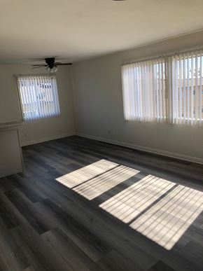 Los Angeles apartment for rent - an empty living room with wood floors and windows