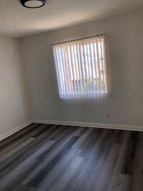 Los Angeles apartment for rent - a empty room with wooden floors and a window
