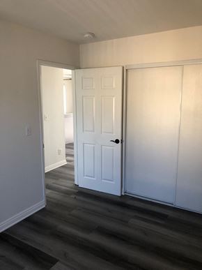 Los Angeles apartment for rent - a living room with white doors and a wood floor