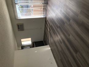 Los Angeles apartment for rent - a small room with a refrigerator and a window