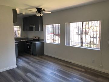 Los Angeles apartment for rent - an empty kitchen with wood floors and a ceiling fan