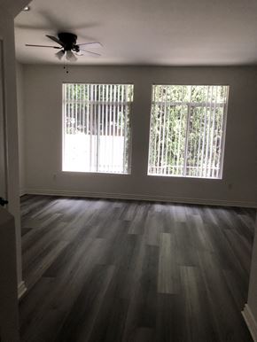 Los Angeles apartment for rent - A room with a ceiling fan and two windows.
