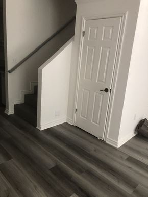 Los Angeles apartment for rent - A white door is on the right side of a staircase.