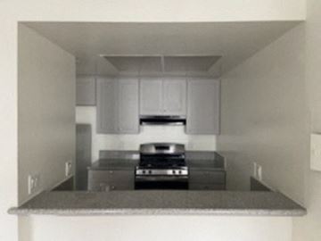 Los Angeles apartment for rent - a kitchen with a counter top and a stove
