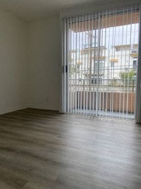 Los Angeles apartment for rent - a living room with a wood floor and a sliding glass door