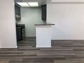 Los Angeles apartment for rent - a living room with a white pillar and wood flooring