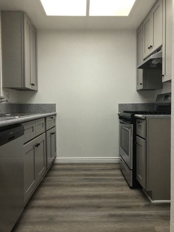 Los Angeles apartment for rent - a kitchen with stainless steel appliances and white cabinets