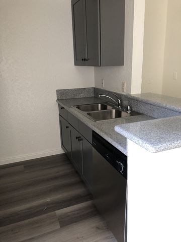 Los Angeles apartment for rent - a kitchen with granite counter tops and a stainless steel sink