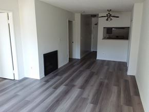 Venice apartment for rent - a renovated living room with hardwood floors and a fireplace