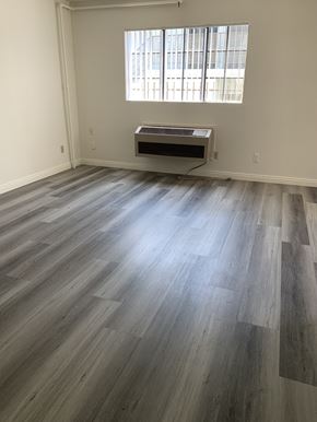 Los Angeles apartment for rent - an empty living room with wood floors and a window
