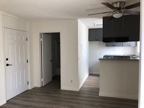 Los Angeles apartment for rent - a living room with a kitchen and a ceiling fan