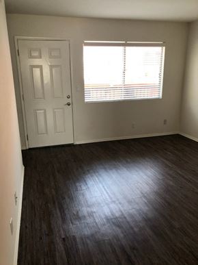 Los Angeles apartment for rent - an empty living room with wood floors and a window