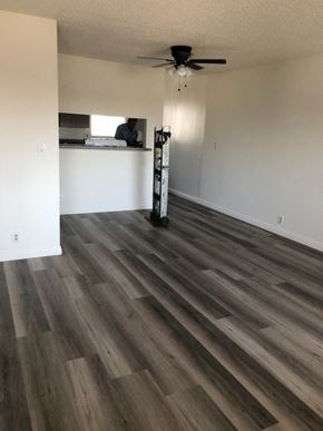 Los Angeles apartment for rent - an empty living room with wood floors and a ceiling fan