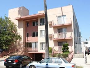 Los Angeles apartment for rent - an apartment building with cars parked in front of it