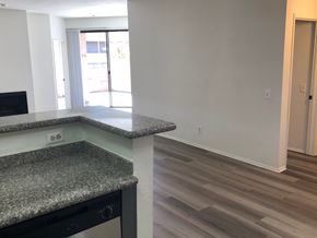 Los Angeles apartment for rent - a view of a kitchen and a living room with wood flooring