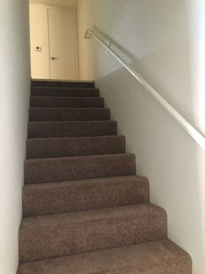 Los Angeles apartment for rent - a flight of stairs with a hand rail and a door