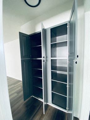 Los Angeles apartment for rent - a walk in closet with shelves and a black door