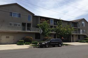 Sherman Oaks apartment for rent - a car parked in front of an apartment building
