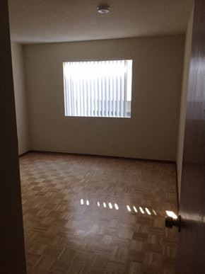 Los Angeles apartment for rent - an empty room with a window and wooden floors