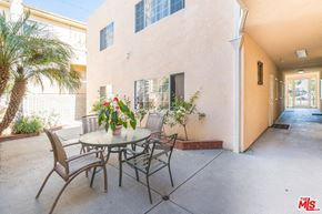 North Hollywood apartment for rent - a patio with a table and chairs in front of a house