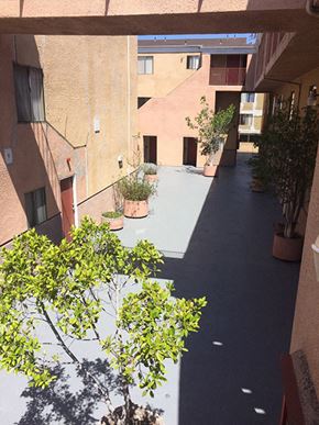 Los Angeles apartment for rent - a courtyard with trees and potted plants in an apartment building