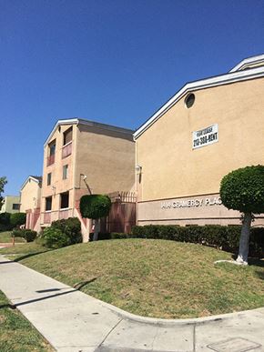 Los Angeles apartment for rent - a brick building with a sign on the side of it