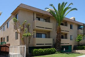 Los Angeles apartment for rent - an apartment building with a palm tree in front of it