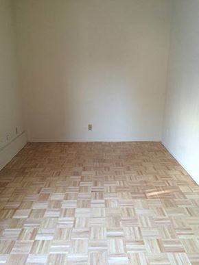 Los Angeles apartment for rent - a room with a wooden floor and a white wall