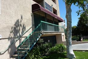 Los Angeles apartment for rent - an apartment building with stairs  and a tree