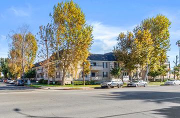 Winnetka apartment for rent - a city street with houses and trees and a mountain in the background