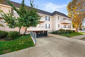 Winnetka apartment for rent - the sidewalk in front of an apartment building with a driveway