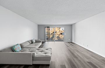 Winnetka apartment for rent - a living room with a couch and a sliding glass door