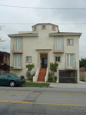 Los Angeles apartment for rent - a white house with a car parked in front of it