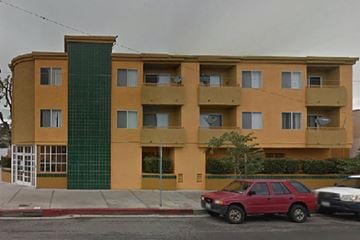 San Pedro apartment for rent - a red car parked in front of an apartment building